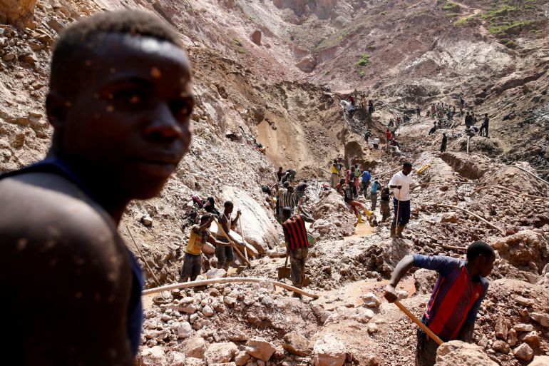 Labourers work at an open shaft of the SMB coltan mine near the town of Rubaya in the Eastern Democratic Republic of Congo, August 13, 2019