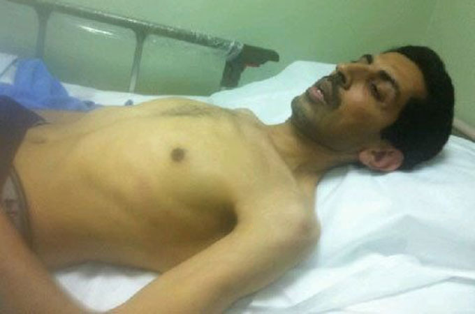 Abdulhadi al-Khawaja in his hospital bed on Saturday.  (Photo Courtesy of Al Jazeera).