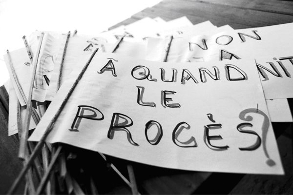 Signs photographed in 2008 read "When the trial?" in French. In June 2016, MLC leader Jean-Pierre Bemba was convicted to 18 years in prison by the international criminal court for the rape and pillage committed by his troops in CAR. By then, violence had returned to the country. In the early hours of 24 March 2013, Muslim Seleka rebels marched into Bangui, overthrowing President Francois Bozize. Not long after, Christian militias called Anti-balaka ("anti-machete") began organising revenge attacks and targeting Muslim civilians. [Heidi Specogna]