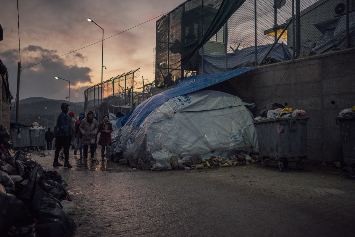 An improvised shelter can be seen inside and outside Moria camp. Often just provided with summer tents, people try to make those fit for winter and the harsh weather conditions. [Kevin McElvaney/Al Jazeera]