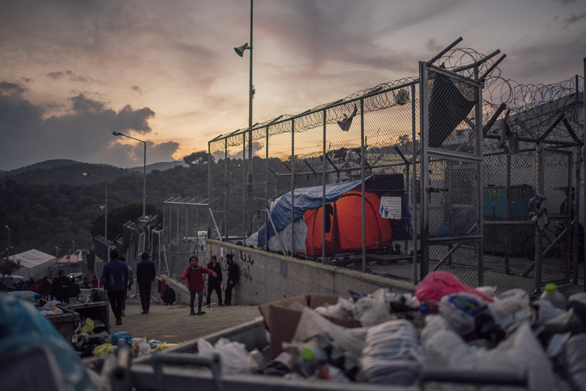 A former military base, the site of Moria camp can easily be mistaken for a prison. Stretching along a hilltop and with many fenced sections, it is confusing to find your way around. [Kevin McElvaney/Al Jazeera]