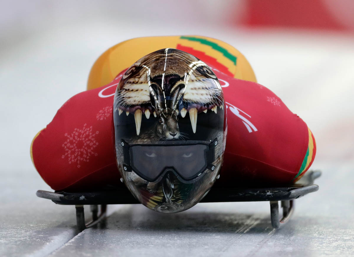 Akwasi Frimpong of Ghana starts his practice run during the men's skeleton training at the 2018 Winter Olympics in Pyeongchang, South Korea. Frimpong is the first West African to compete in the skeleton competition. [Wong Maye-E/AP Photo]