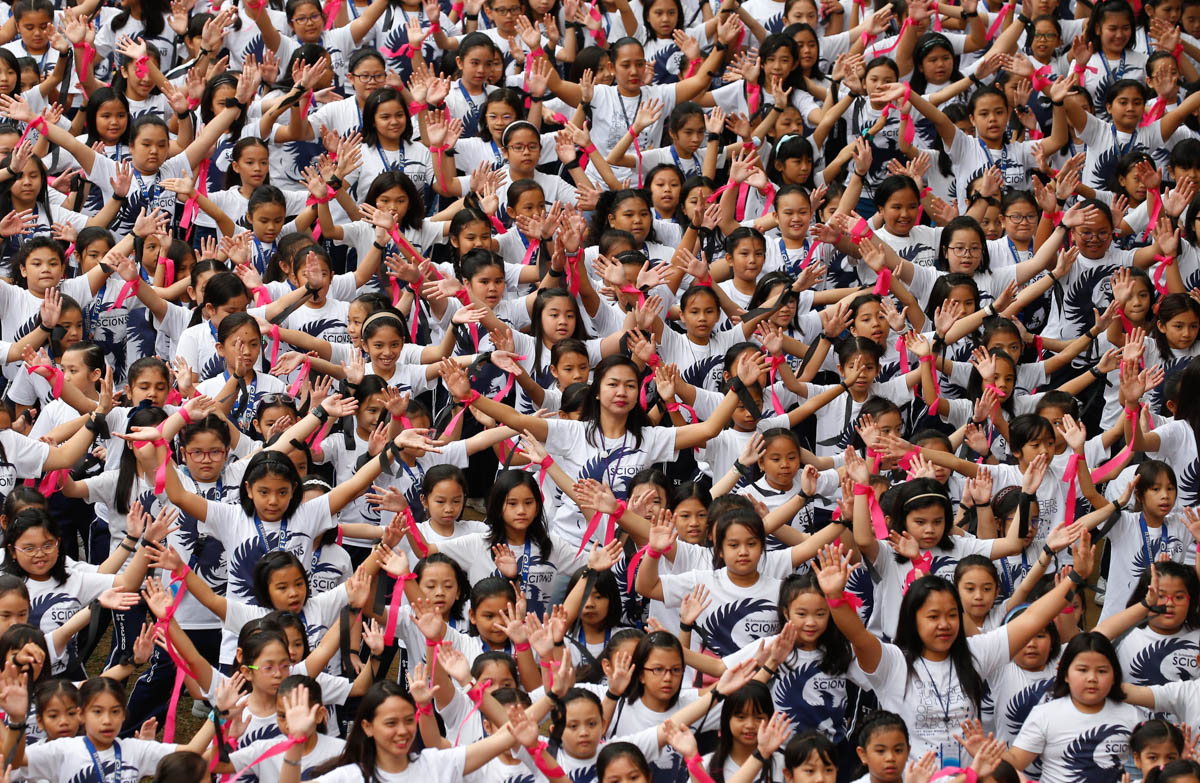 Thousands of students and faculty from the Catholic-run St Scholastica's College, dance en masse for women's rights in Manila, Philippines. The annual mass dancing event, dubbed One Billion Rising, is held every Valentine's Day. [Bullit Marquez/AP Photo]