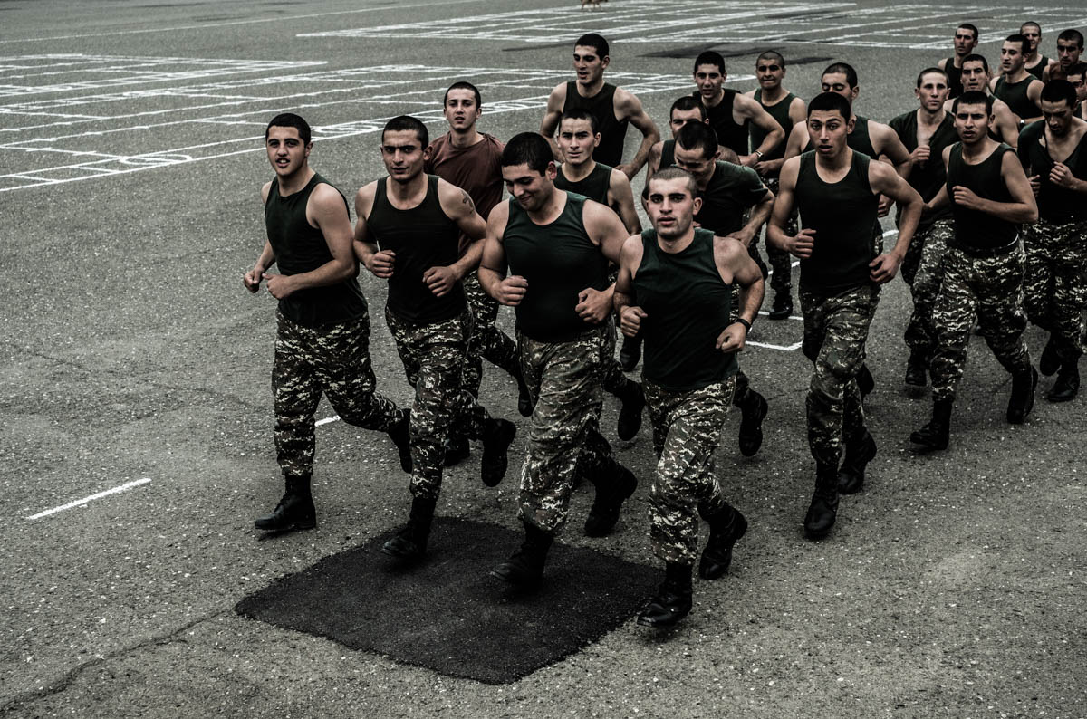 Conscripts run laps in the yard of a military base in Martuni. [Gus Palmer/Al Jazeera]