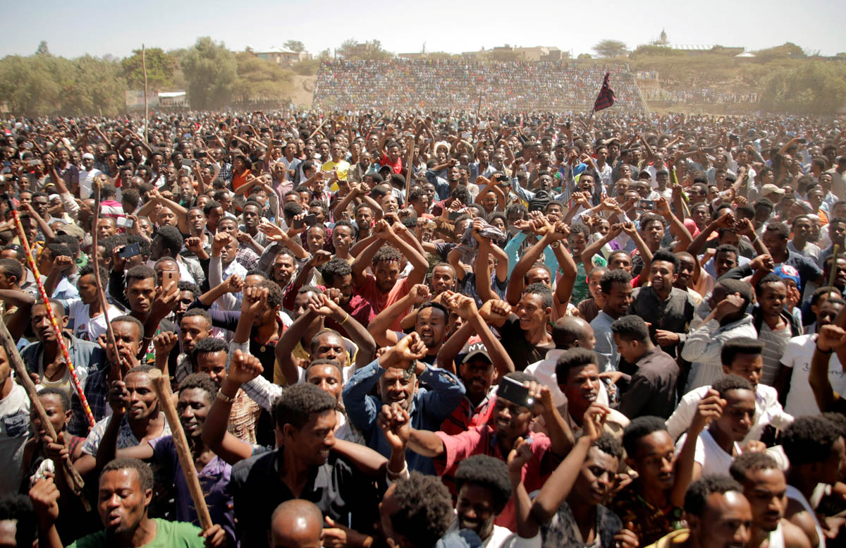 Supporters of Bekele Gerba, secretary general of the Oromo Federalist Congress (OFC), chant slogans to celebrate Gerba's release from prison, in Ethiopia. [Tiksa Negeri/Reuters]