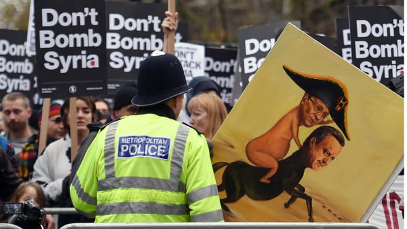 Demonstrators protest against British bombing of Syria outside Downing Street in London on Saturday [Andy Rain/EPA]