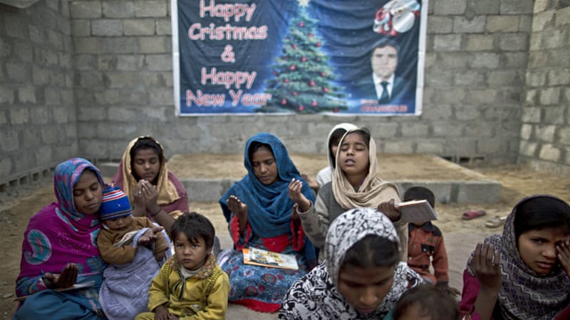 Pakistani Christians pray in a makeshift church in a slum on the outskirts of Islamabad, Pakistan [Muhammed Muheisen/AP]