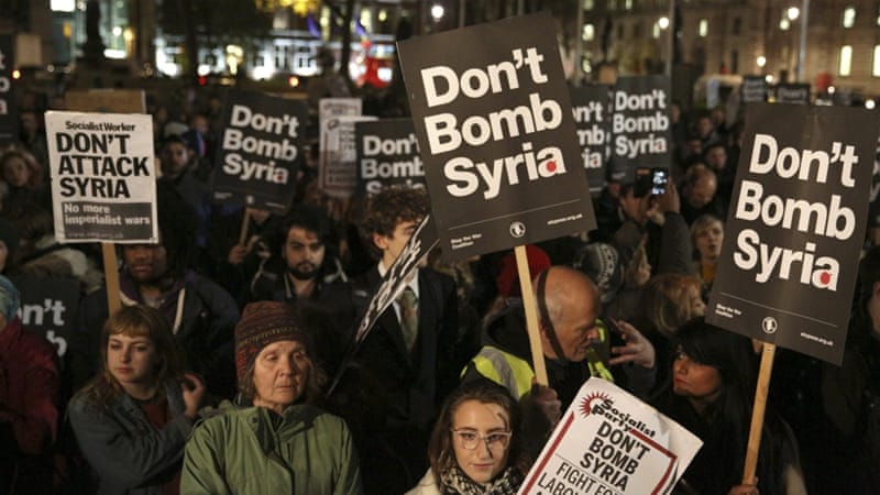 Anti-war protesters demonstrate against proposals to bomb Syria outside the Houses of Parliament in London [REUTERS]