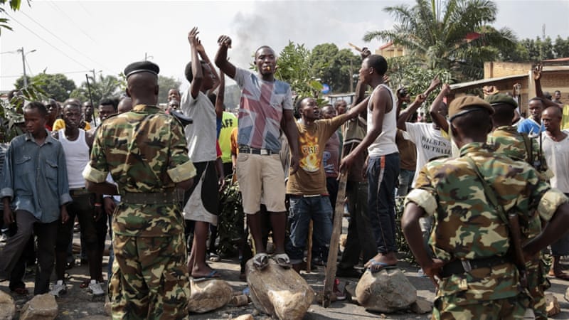 Opposition demonstrators confront army soldiers in Bujumbura, Burundi [AP]