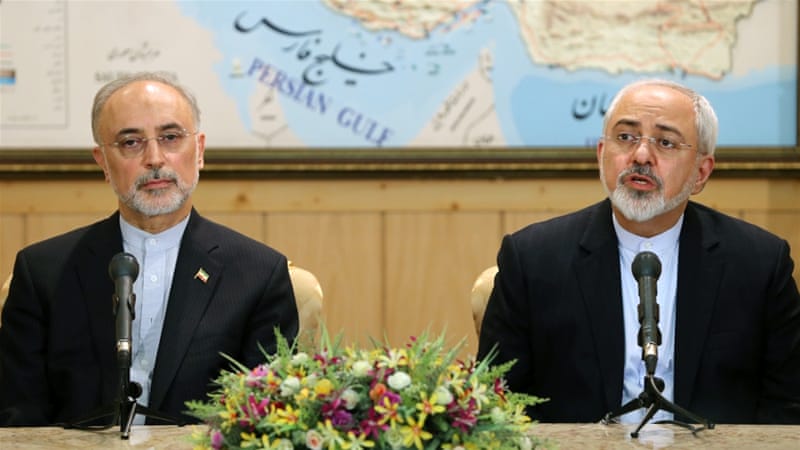 Foreign Minister Mohammad Javad Zarif, right, who led the negotiations, is now back in Tehran [AP]