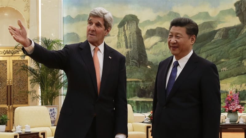 US Secretary of State John Kerry with Chinese President Xi Jinping in Beijing [AP]