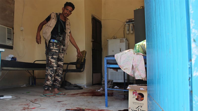 A man inspects the elderly care home after it was attacked by gunmen in Aden on Friday [Wael Qubady/AP] 
