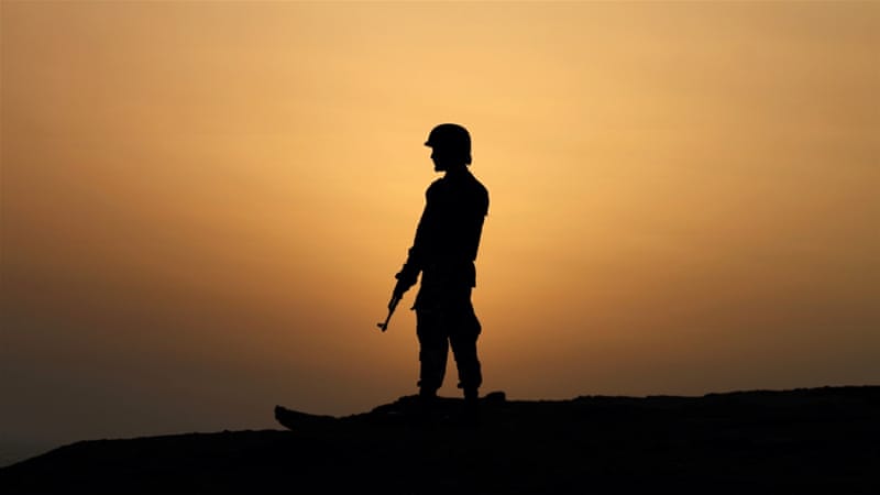 A Pakistan Navy soldier stands guard at a hilltop position near Gwadar port, west of Karachi. Pakistan [AP]
