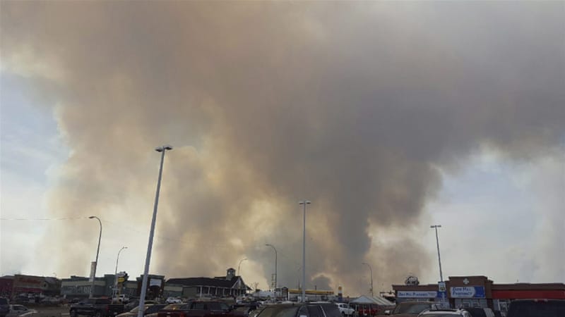 No casualties have yet been reported but gas stations exploded and a hotel and one of the town's many motor home parks went up in flames, according to local media [Mary Anne Sexsmith-Segato/The Canadian Press via AP]