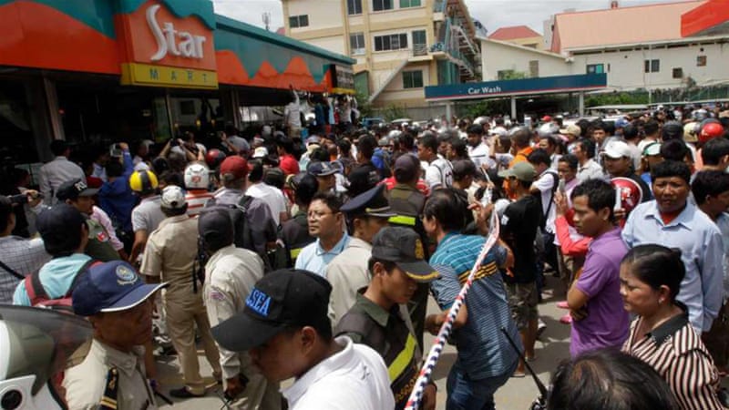 Hundreds gathered outside the store Kem Ley was killed as many of them mourned [AP]