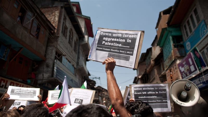 Kashmiri activists hold placards during a protest against Israel's military operation in Gaza on July 11, 2014, in Srinagar [Getty]