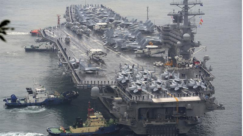 The USS Ronald Reagan aircraft carrier is one of three strike groups heading towards the Korean Peninsula [File: Ha Kyung-min/Newsis via AP]