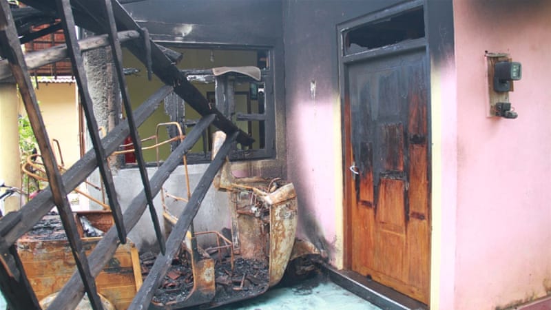 Rows of burned houses and businesses bear testimony to the violence [M Riza/Al Jazeera]