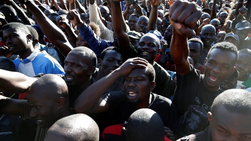 People gesture during a commemoration of the lives of opposition supporters killed during confrontations with the security forces over the election period in Nairobi [Baz Ratner/Reuters]