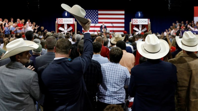 A supporter raises his cowboy hat as US President Donald Trump speaks about tax reform during a visit to Loren Cook Company in Springfield, Missouri, US [Kevin Lamarque/Reuters]