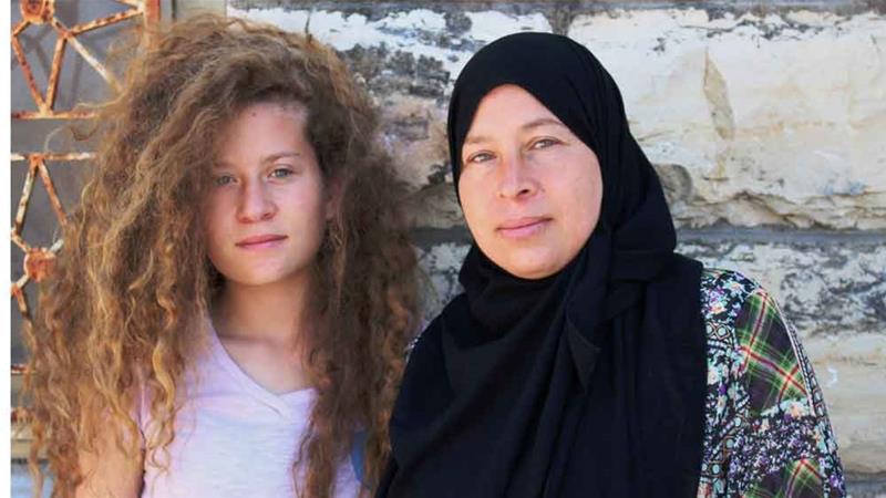 Palestinian activist Ahed with her mother Nariman [Al Jazeera]