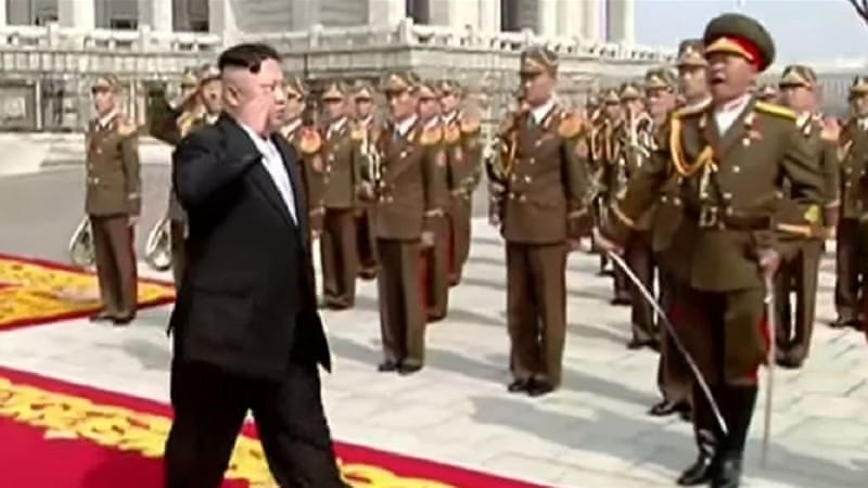 North Korean state television showed Kim saluting his honour guard before walking down a red carpet