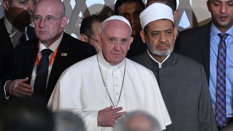 Pope Francis stands next to Sheikh Ahmed al-Tayeb, the Grand Imam of Al-Azhar [Andreas Solaro/AFP]