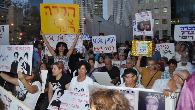 Mizrahi Jews protest on Monday for the theft of their children and loved ones in the 1950s [Yuval Abraham/Al Jazeera] 