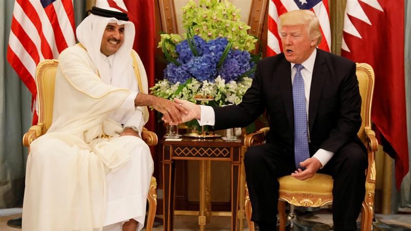 Emir Tamim bin Hamad Al Thani meets US President Donald Trump in Saudi Arabia in May 2017 [Jonathan Ernst/Reuters]