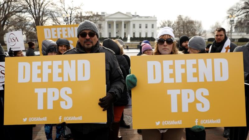 Demonstrators outside the White House protest against the termination of Salvadorans' TPS [Kevin Lamarque/Reuters]