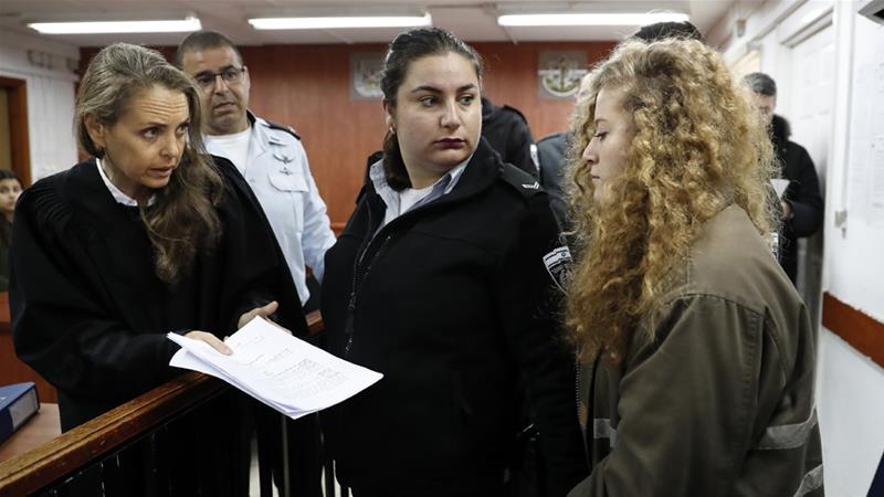 Ahed Tamimi is facing 12 charges, which could lead to her facing years in prison [AFP]