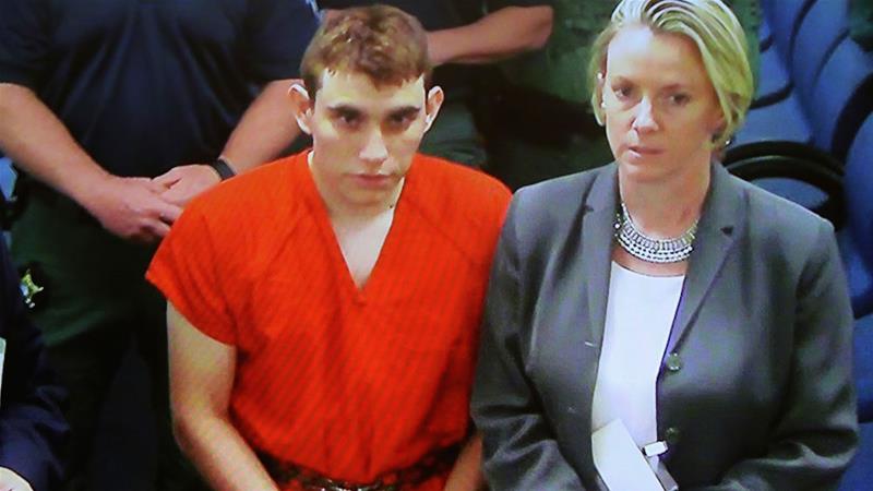A video monitor shows school shooting suspect Nikolas Cruz in court on Thursday [Susan Stocker/South Florida Sun-Sentinel/AP Photo]