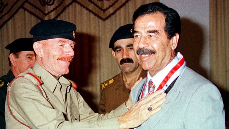Former Iraqi President Saddam Hussein with his aid Ezzat al-Douri [File photo/Reuters]