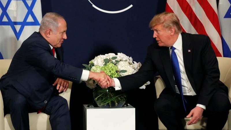 US President Donald Trump shakes hands with Israeli Prime Minister Benjamin Netanyahu during the World Economic Forum's meeting in Davos on January 25 [Reuters/Carlos Barria]