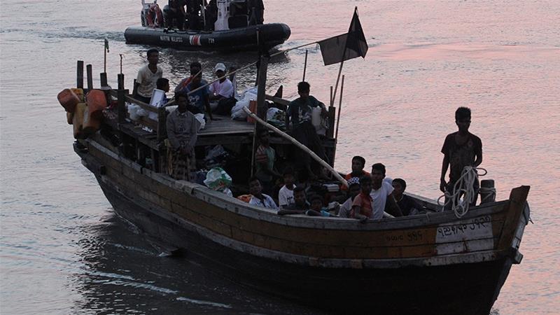 Rohingya refugees intercepted by the MMEA off Langkawi island being handed over to immigration authorities [File: Reuters]