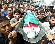 Mourners carry the body of 12-year-old Ibrahim al-Ghranawy