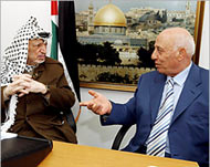Palestinian leader Yasser Arafat (L) with prime minister designate Ahmad Quraya 