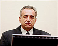 Momir Nikolic listens as the judge sentences him to 27 years in jail 