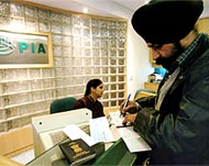 An Indian man buys tickets at the PIA office in New Delhi
