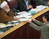 Reformist MP Ahmad Moradi (R) hands over his resignation  