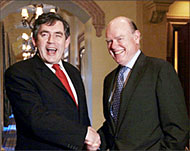 Smiles apart: UK's Gordon Brown (L) and US Treasury's John Snow