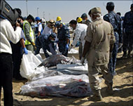 Recovered bodies are wrappedin plastic bags 