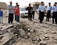 Friday's roadside bomb left a crater in the street but no injuries