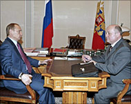 Putin (L) said he wanted to giveRussia a glimpse of his new team