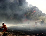 Fire fighters tend to a pipeline blaze earlier this week 
