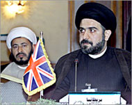 Al-Sadr is wanted for the murder of Abd al-Majid al-Khoei (R) 