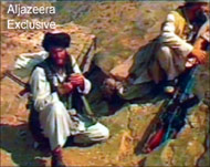 Taliban fighters pose the gravestthreat to Karzai's chances