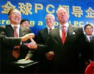 Lenovo's Liu Chuanzhi (L) and John Joyce concluded the deal