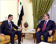 With Syria's Bashar al-Asad (L)
