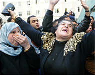 Lebanese women react to newsof al-Hariri's death on Monday